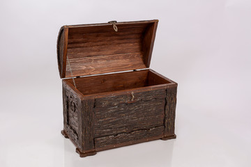 Wooden chest for household items and clothes on white background.