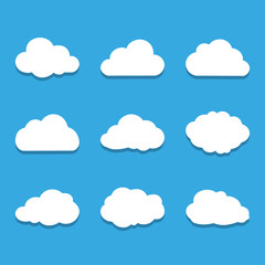 set of white paper clouds on the blue background