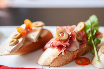 Carpaccio bread Pamaham, foie gras and rocket lettuce and cranberries sauce