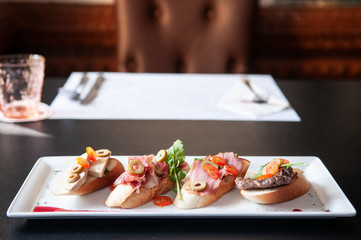 Carpaccio bread Foie gras, Pamaham, smoked duck, beef steak and cranberries sauce