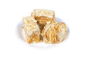 three pieces of Napoleon cake on a white plate