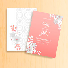 Beautiful wedding invitation card template layout decorated with paper cut flowers.
