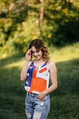 A girl in a hat on a walk in the park