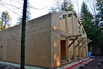 Construction of a chalet in the forest.