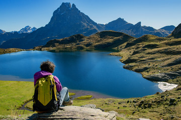 Fototapeta premium woman hiker sitting in the Pyrenees mountains near the Pic du Midi d Ossau