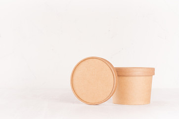 Blank brown paper bowl and cap for food takeaway on solf light white background, mockup for brand, design, advertising.