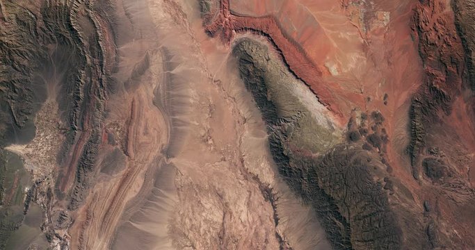 Very high-altitude overflight aerial of desert terrain in northwestern Argentina. Reversible, seamless loop. Elements of this image furnished by NASA. 