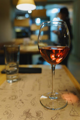 Glass of rose wine on the table