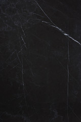 The texture of the natural stone is dark marble with patterns and white stripes, the stone is...