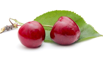 Cherry with leaves isolated on white background