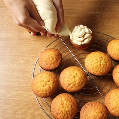 making muffins with cream. cookies in a box