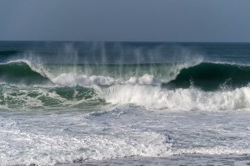 Atlantic ocean waves by Nazare North beach,  Portugal.