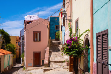 Fototapeta premium Bosa, Sardinia, Italy - Bosa historic old town quarter with colorful tenements and narrow street of Via Muruidda