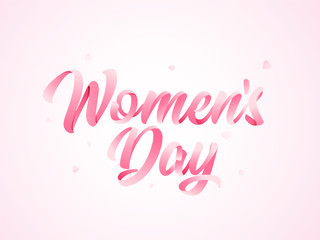 Fototapeta na wymiar Calligraphy of Women Day text on pink background.