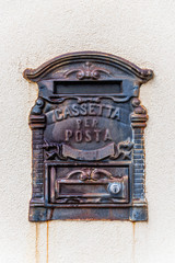 Rusty Italian Mailbox on a Wall