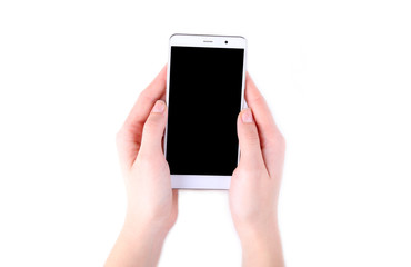 Female hands holding mobile phone with blank screen isolated on white