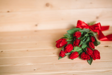 Beautiful Rustic background with Red Tulips. Colorful Card for Mothers Day, Birthday, International Women's Day March 8