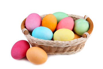 Fototapeta na wymiar Colorful easter eggs in basket isolated on white background