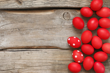 Red Easter eggs on old wood