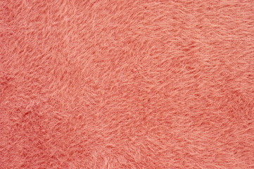 Coral colored fluffy fake fur texture