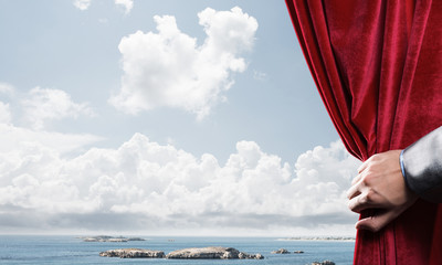 Summer natural bluesky view behind red velvet curtain