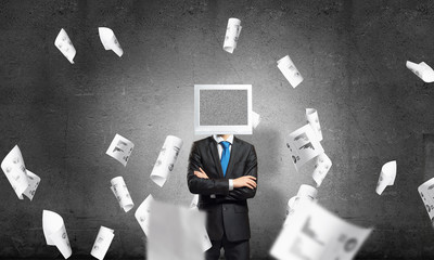 Businessman with monitor instead of head.