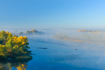 Fog over the water on a river Dnieper on autumn