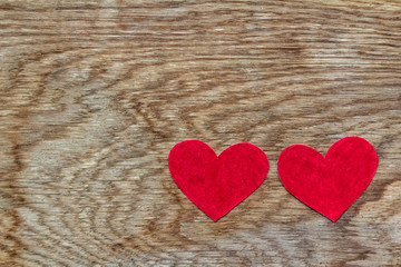 Valentines day two red hearts on wood with copy space with Valentines day concept