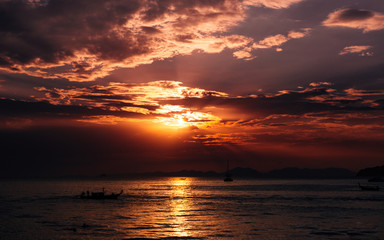Long tail traditional boats moored, sunset twilight Ao Nang, Krabi Province, with limestone islands in the background, Krabi, Thailand, Southeast Asia.
