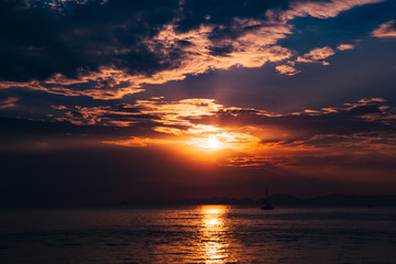Long tail traditional boats moored, sunset twilight Ao Nang, Krabi Province, with limestone islands in the background, Krabi, Thailand, Southeast Asia.