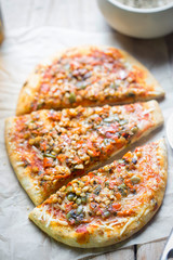 Mushroom & vegetable sourdough pizza. Pizza topped with tomato sauce, mozzarella cheese, oyster mushrooms and onion.  