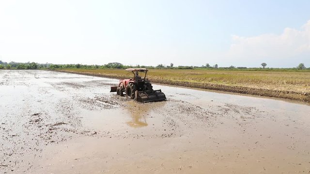 Tractor on harvest field, rural scene