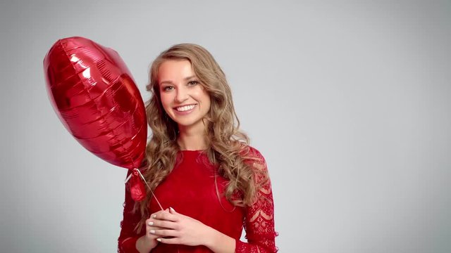 Woman with heart shaped balloon