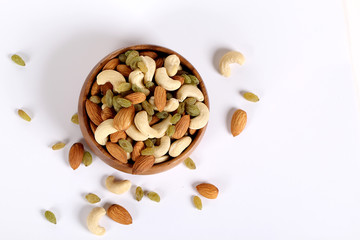 ssorted nuts on white, dry fruits, mix nuts, almond, cashew,  raisin