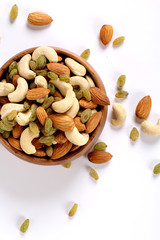 ssorted nuts on white, dry fruits, mix nuts, almond, cashew,  raisin