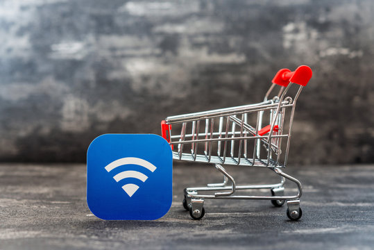 Business concept photo - shopping cart with Wireless network symbol