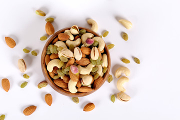 ssorted nuts on white, dry fruits, mix nuts, almond, cashew, pistachio, raisin