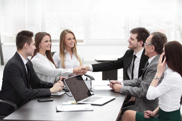 business partners shaking hands after a successful transaction