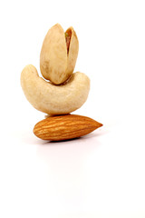 ssorted nuts on white, dry fruits, mix nuts, almond, cashew, pistachio, raisin