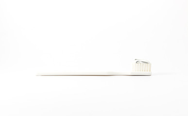 Toothbrush with toothpaste and fresh leaves of mint