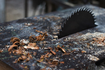 Sawdust on a woodworking machine.
