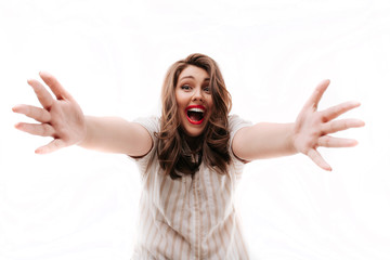 Excited plump woman ready to hug camera