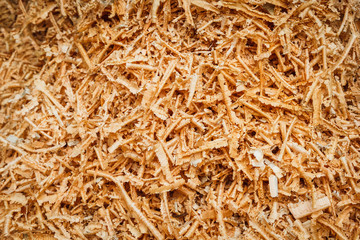 Sawdust on a woodworking machine.