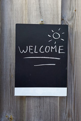 Welcome written on a chalkboard