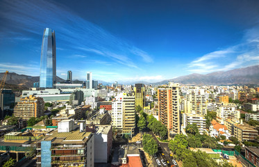 Naklejka premium Aerial view of a city and The Andes mountain in the background, Santiago, Chile