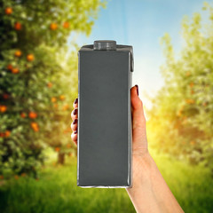 Juice product in woman hands. Free space for your decoration.