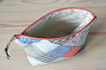 Handmade quilting notion pouch on the table	