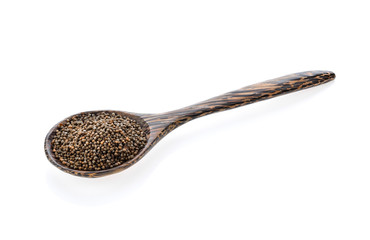 sesame in wood spoon isolated on white background