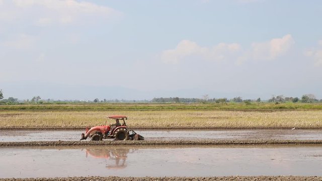 Tractor on harvest field, rural scene