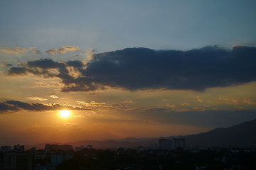 beautiful dramatic sunset sky above the city skyline